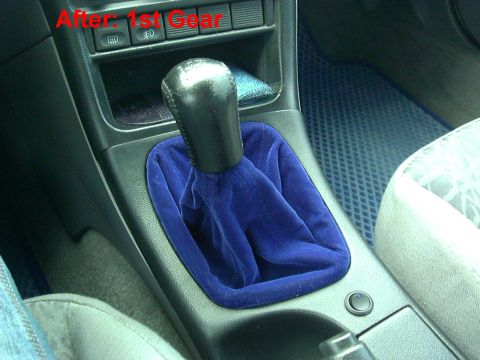 1995 Ford Probe - Interior shot of a car's shifter with a blue velvet boot and text overlay.