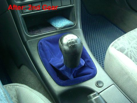 1995 Ford Probe - Close-up of a car's gear shifter and surrounding console area, with a blue velvet boot and a text overlay.