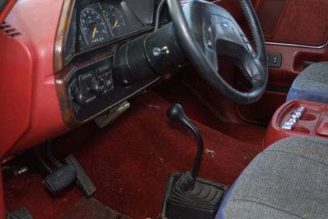 1989 Ford Bronco - The interior of a 1989 Ford Bronco shows the manual transmission shifter and dashboard instrumentation.