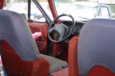 1989 Ford Bronco - View from the passenger seat of a van, looking towards the driver's side and out the windshield.