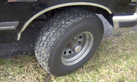 1989 Ford Bronco - Close-up of the front wheel and fender of a 1989 Ford Bronco.