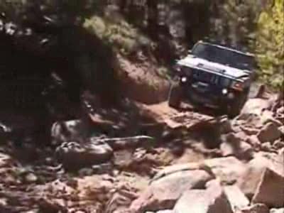 1989 Ford Bronco - Nice, Hummer off road, but what a weak damn setup... watch it break! HAHA!