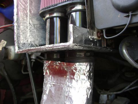 1995 Ford Bronco - This image shows a custom engine air intake system with K&N filters and heat shielding.