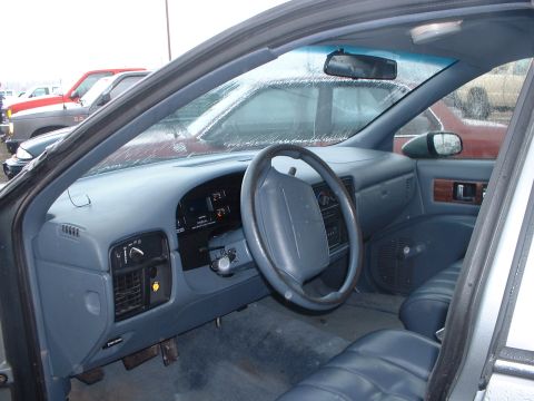1999 Ford Crown Victoria - Interior of a 1994 Chevrolet Caprice sedan, with other vehicles seen through the windshield.