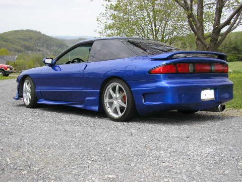 1994 Ford Probe - This blue 1994 Ford Probe features a custom body kit and a prominent rear spoiler.