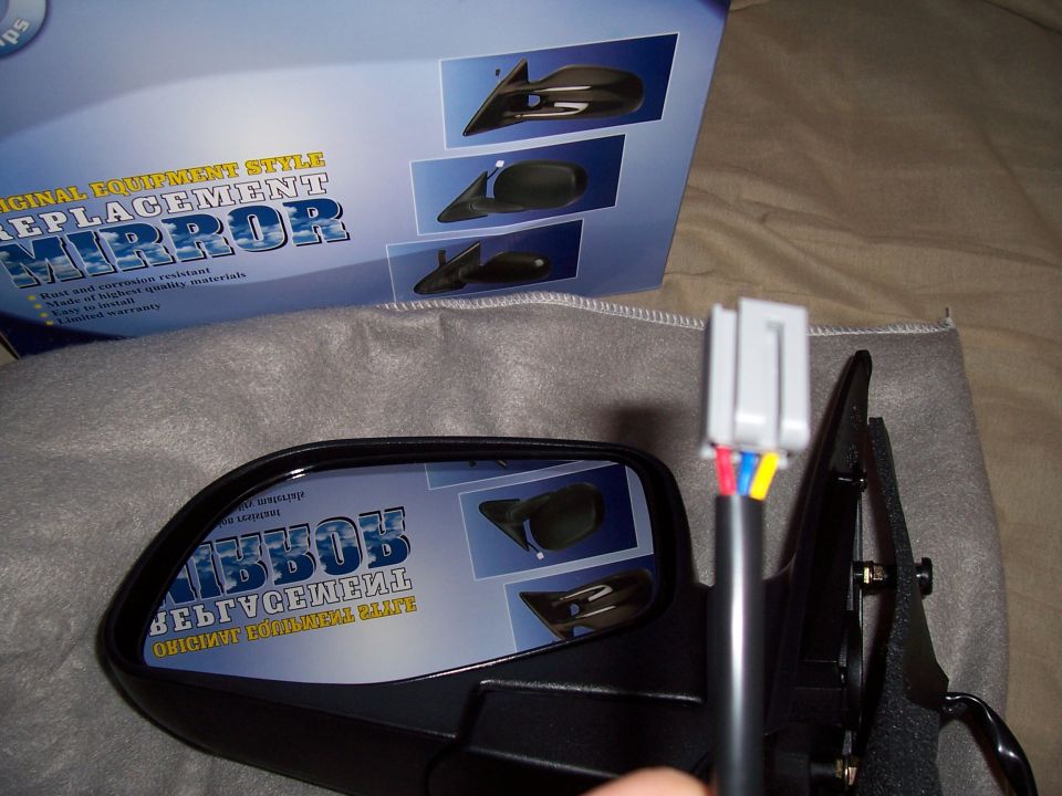 Replacement side mirror with wiring harness and packaging showing diagrams of mirror installation