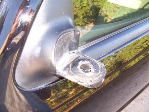 2003 Ford Ranger - The mounting bracket for the side mirror is broken and detached from the door.
