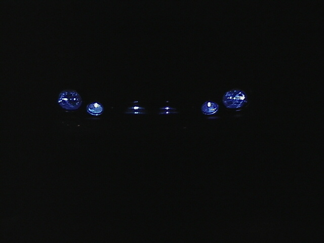 Blue lights on a dark surface, possibly aftermarket lighting