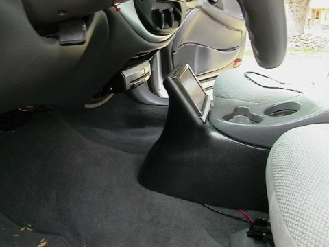1999 Ford Taurus - A close-up shot of a vehicle's interior, focusing on the dashboard area and steering wheel.