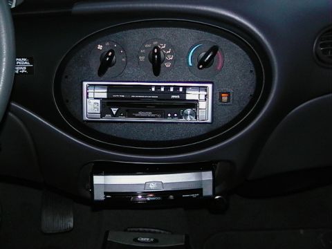 1999 Ford Taurus - Aftermarket audio equipment is visible in the car's dashboard.