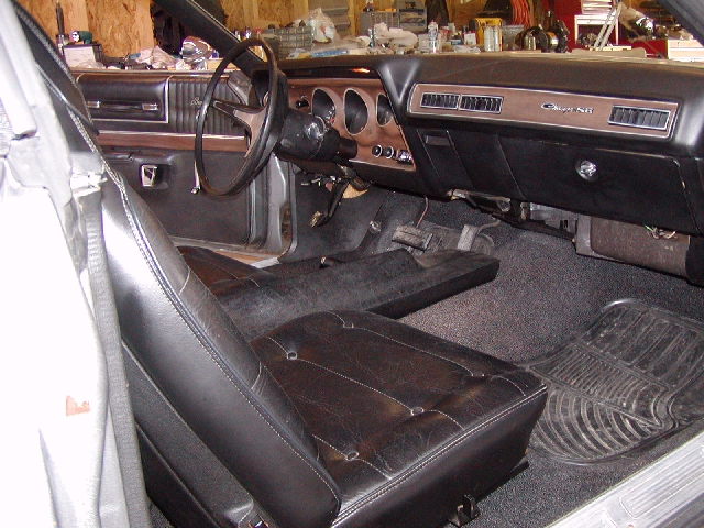 Interior view of a 1973 Dodge Charger, showing dashboard, steering wheel, and seats