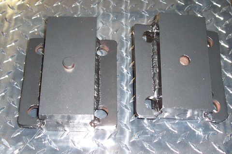 1994 Ford F-150 - These are aftermarket lift blocks for vehicle suspension.