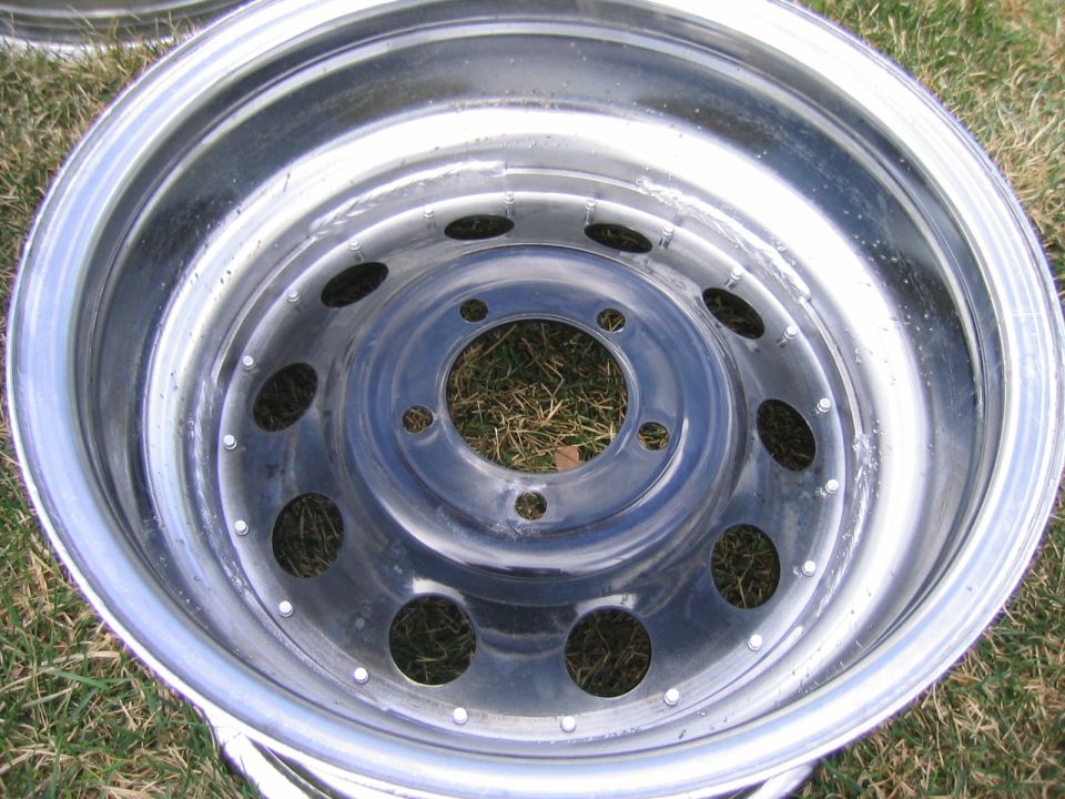 Chrome wheel with multiple lug nut holes and a polished lip