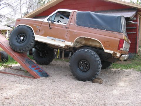 1981 Ford Bronco - 651 on a 30 degree ramp. Equates to 952 on a 20 degree ramp. The coil / radius arm suspension would do about 700 on a 20 degree ramp.