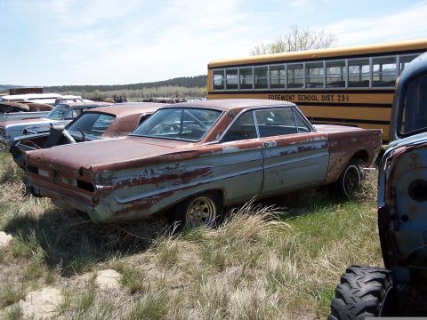 1968 Ford Coupe - Junkyard scene with a rusty 1965 coupe and a school bus.