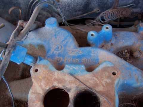 1968 Ford Coupe - Close-up of a blue Ford intake manifold, showing the part number C8OE-9425-C and the Ford logo.
