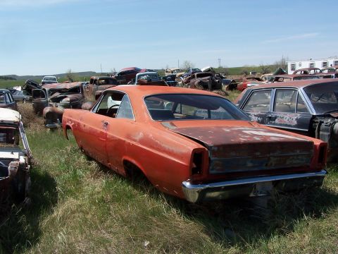 1968 Ford Coupe - Junkyard scene with a rusty 1966 Ford Fairlane coupe as the main subject.