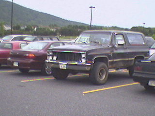 1989 Ford Bronco - Crazy, just crazy! This Blazer has no front end! The headlights are all held in place with CLEAR PACKING TAPE and a BUNGEE CORD! The right…