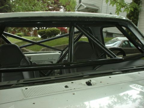 1995 Ford Bronco - The interior of a 1995 Ford Bronco features a prominent roll cage.