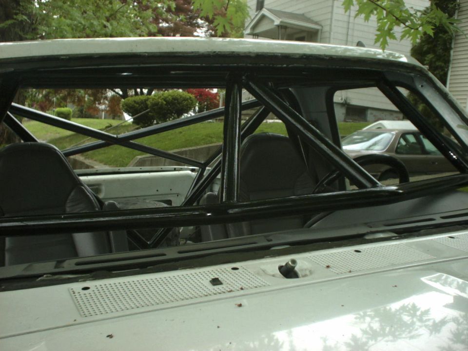 1995 Ford Bronco interior with roll cage