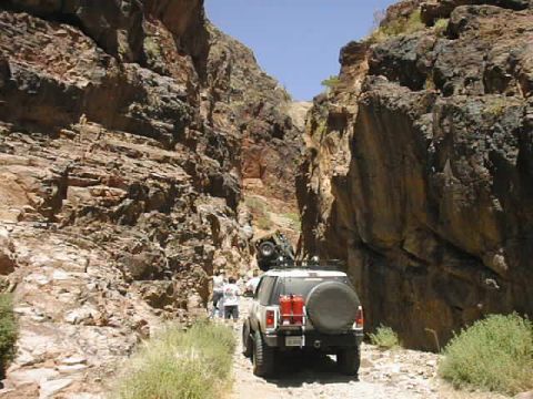 1997 Ford Ranger - Two off-road vehicles navigate a narrow, rocky canyon during a trip.