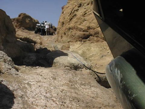 1997 Ford Ranger - Off-roading adventure on a challenging, rocky path with multiple vehicles and people.