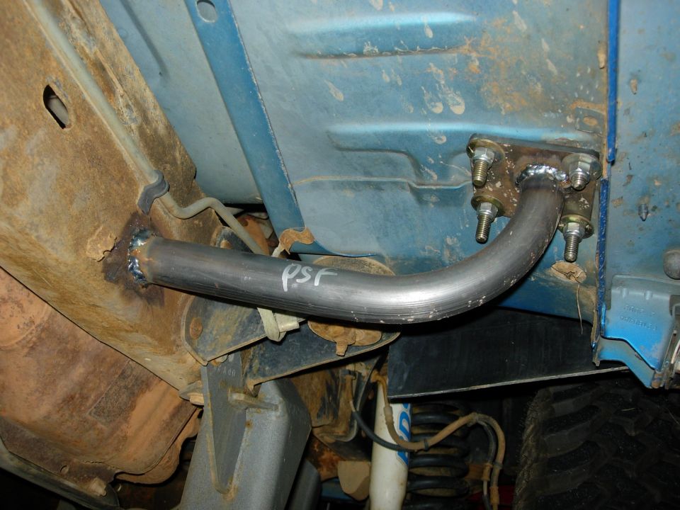 Fabricated steel crossmember tube bracket welded under a blue vehicle marked PSR