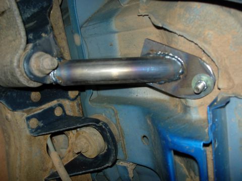 1995 Ford Bronco - points directly behind the front seat are tied into the forward leaf spring brackets