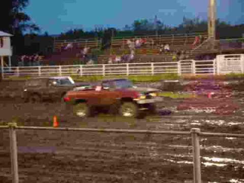 1978 Ford Bronco - Mud flies as a 1978 Ford Bronco competes in a drag race event.