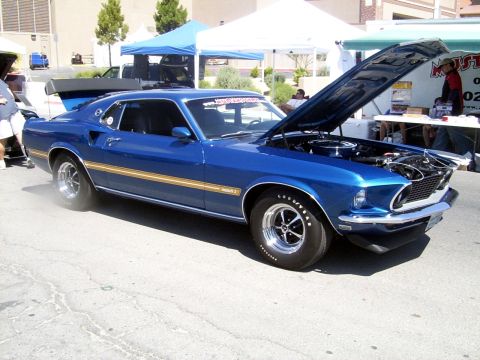 2002 Ford Mustang - Blue 1969 Ford Mustang Mach 1 on display with hood open.
