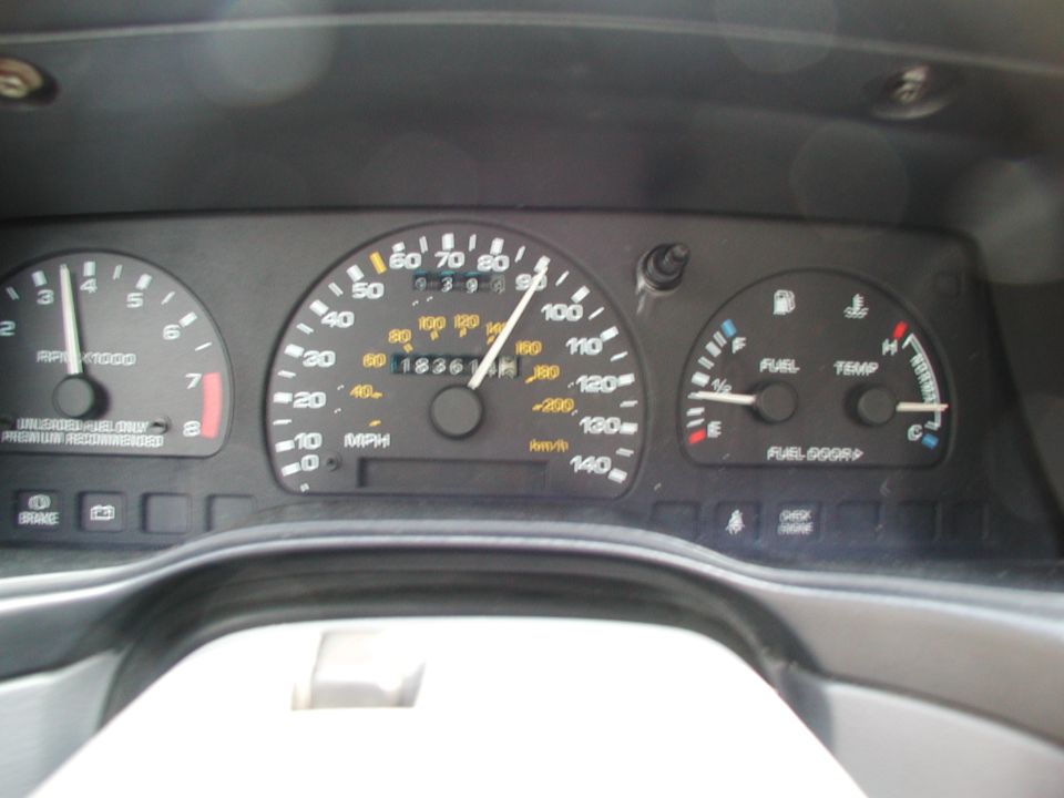 1992 Ford Taurus dashboard with speedometer, tachometer, fuel, and temperature gauges. Odometer reads 18361