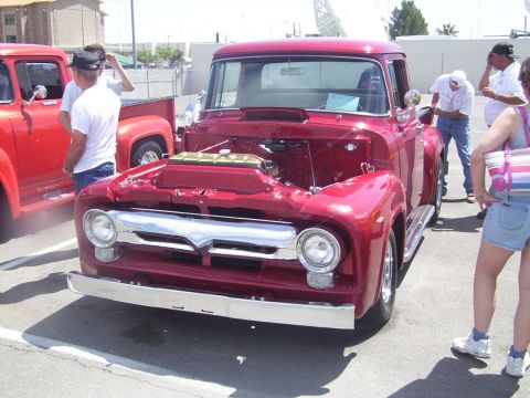 2002 Ford Mustang - Front view of a customized 1956 Ford F-100 pickup truck at an outdoor event.