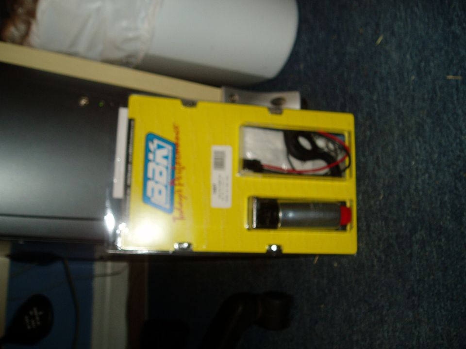 Yellow box containing a fuel pump and wiring harness