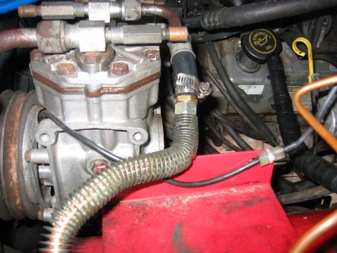 1989 Ford Bronco - Stock wire from the compressor, connected to the wire from the pressure switch. All the compressor needs is 12V to this wire, as the case i…