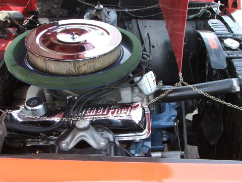 2005 Ford Mustang - The engine bay features a chrome air cleaner assembly and prominent 'Ford' branding on the valve covers.