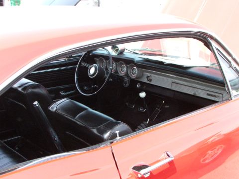 2005 Ford Mustang - Interior of a vintage Comet GT, black seats and a classic dashboard layout.