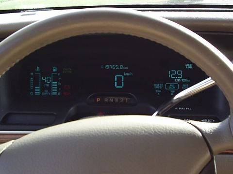 1997 Ford Crown Victoria - Digital dashboard of a 1997 Ford Crown Victoria displays speed, odometer, fuel, and temperature.