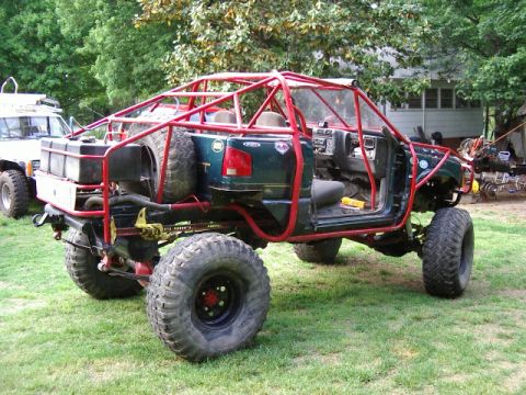 1985 Ford Bronco - This custom truck features an extensive roll cage and oversized tires for extreme off-roading.