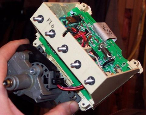 1985 Ford Crown Victoria LTD - Close-up of a vehicle's electronic control module, showing intricate circuitry and wiring.