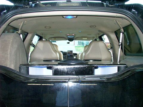 2000 Ford Excursion - Custom speaker box installed in the rear cargo area of a 2000 Ford Excursion.