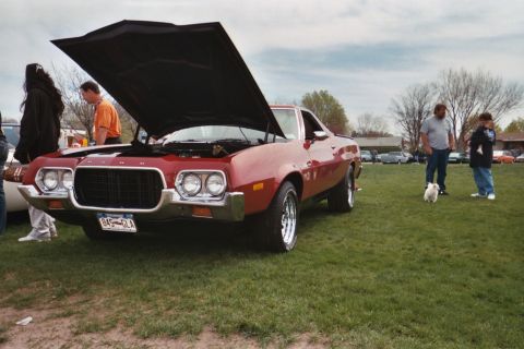 1972 Ford Ranchero - A red 1972 Ford Ranchero is displayed with its hood open at a car show.