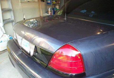 1998 Ford Crown Victoria - Rear view of a 1998 Ford Crown Victoria, showing the taillight and trunk details.