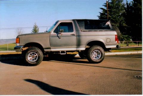 1987 Ford Bronco - This 1987 Ford Bronco is equipped with a soft top and off-road tires.