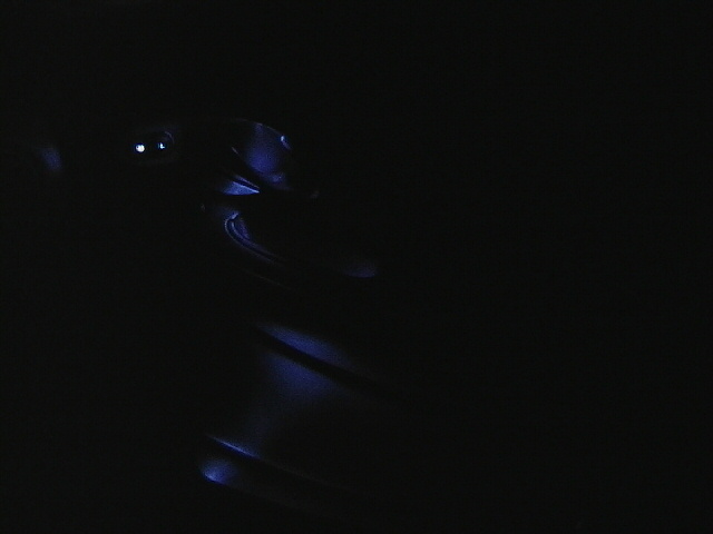 Car interior with blue ambient lighting visible