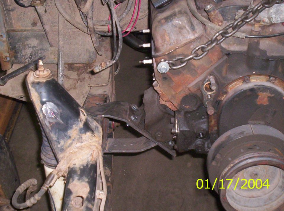 Engine suspended by chain being fitted to a bare frame with a custom motor mount bracket, dated 01/17/2004