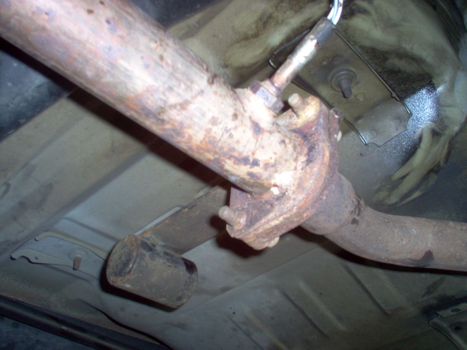 Detail of the R catalytic converter flange showing the stamped nuts & resonance weight.