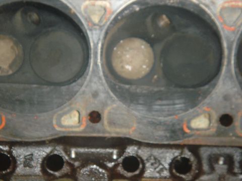 1986 Ford Mustang - Close-up view of engine cylinder heads, showing valves and combustion chambers.