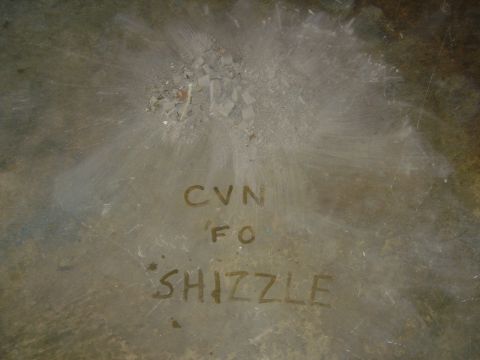 1986 Ford Mustang - A close-up of a metal surface reveals handwritten text and a Supermotors.net logo.