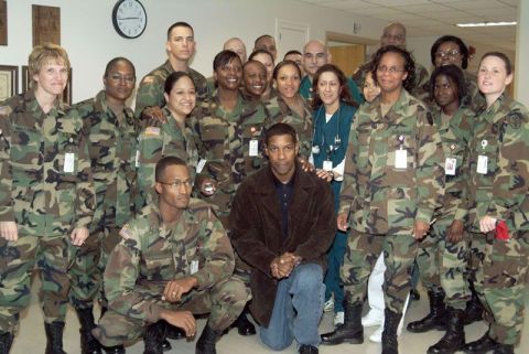 1996 Ford Probe - Denzel Washington poses for a photo with a group of military personnel.