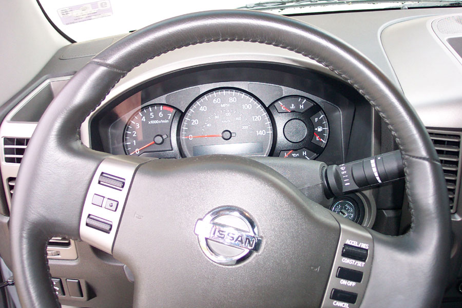 Nissan truck steering wheel and gauge cluster with speedometer and tachometer
